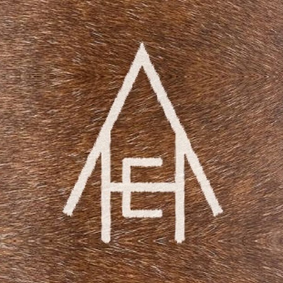 The Heartland Equine Appraisal monogram branded into wood